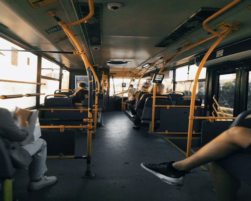 Person wearing comfortable sneakers standing on public transport