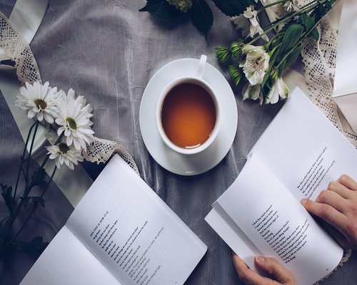 Cup of tea and a book representing daily rhythm and rest